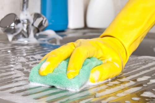 Technician assessing risks and protecting floors during carpet cleaning